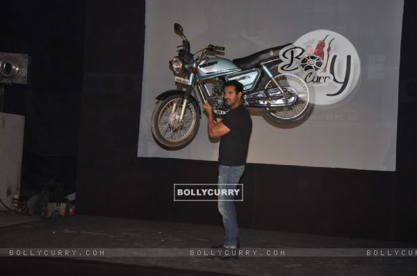 John Abraham lifts a bike at Force promotions in Mehboob, Mumbai (161342)