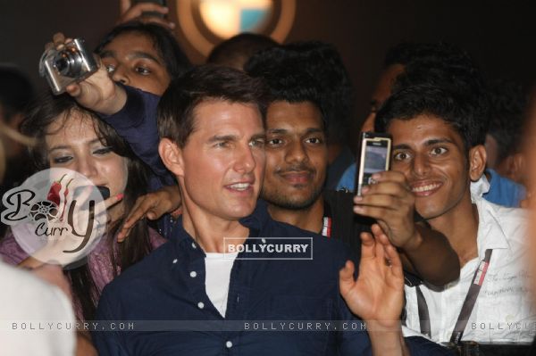 Tom Cruise poses for a photo before a special screening of film Mission Impossible at IMAX Wadala