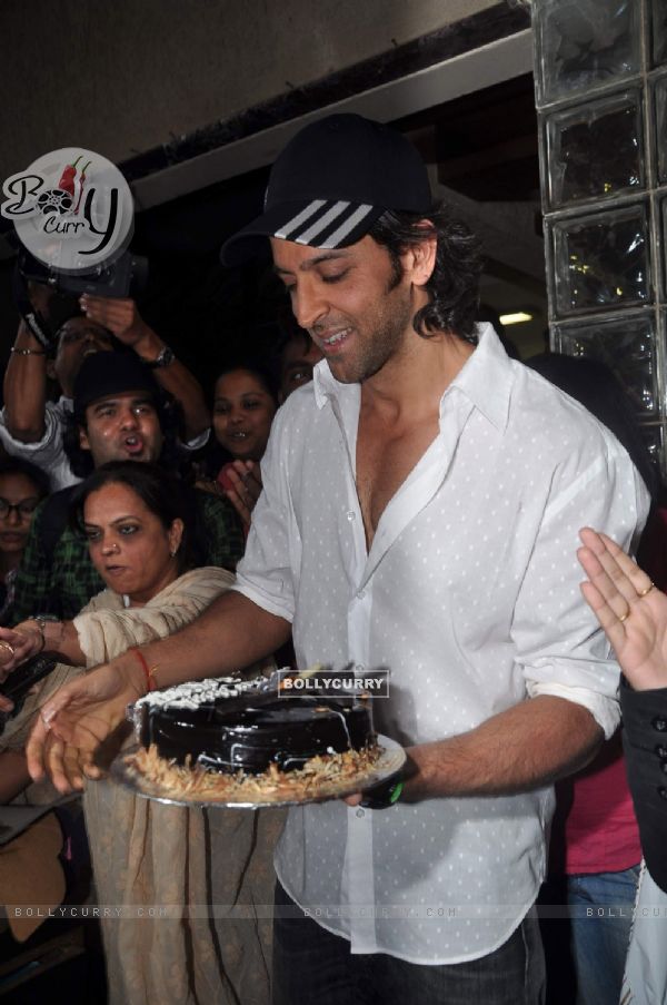 Hrithik Roshan poses with his birthday cake as he celebrates his 38th Birthday in Mumbai