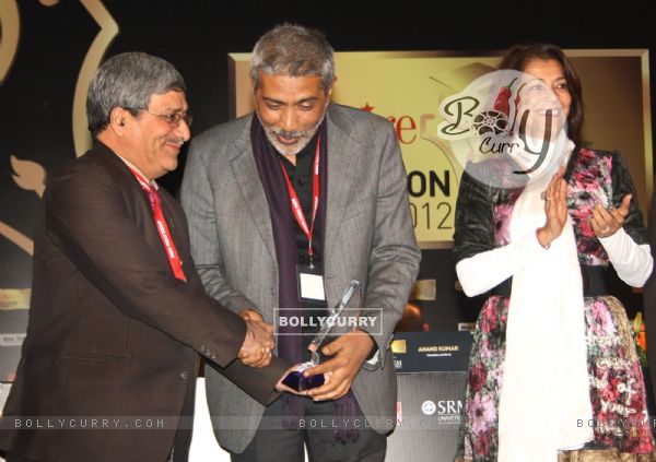 Vice-Chancellor M Aslam receiving the "Best teaching practices Award" from  Prakash Jha in New Delhi