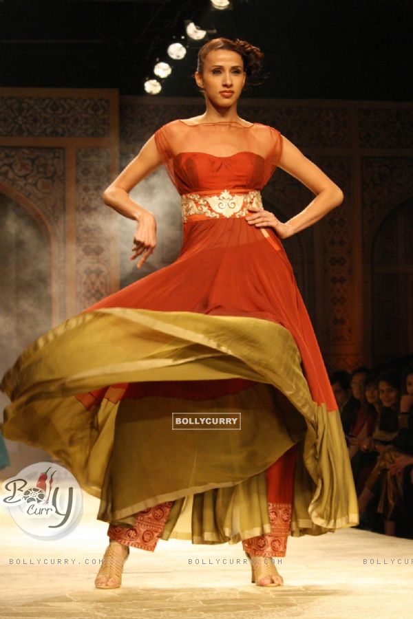 A model displays a creation by designer Manish Malhotra at the Wills Lifestyle India Fashion week 2012,in New Delhi on Friday. .