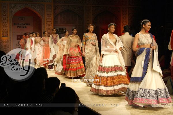 Models displays a creations by designer Manish Malhotra at the Wills Lifestyle India Fashion week 2012,in New Delhi on Friday. .