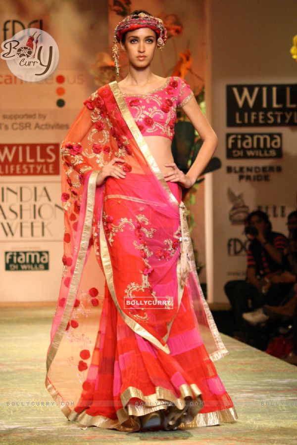 A model displays a creation by designer Suneet Verma  during a special show at the Wills Lifestyle India Fashion week 2012,in New Delhi on Friday. .