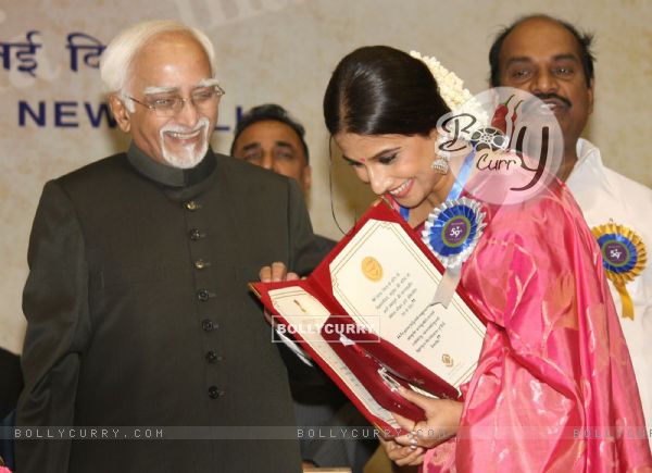 Vice President Hamid Ansari presenting the best actress award to Vidya Balan at the ''59 National Film Awards''