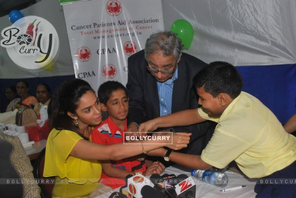 Bollywood actress Mallika Sherawat meets CPAA patients in Mumbai .