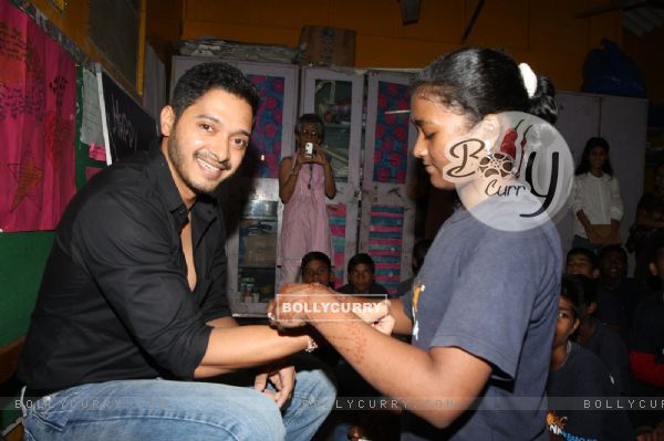 Girls at Akansha tie a rakhi to Shreyas Talpade