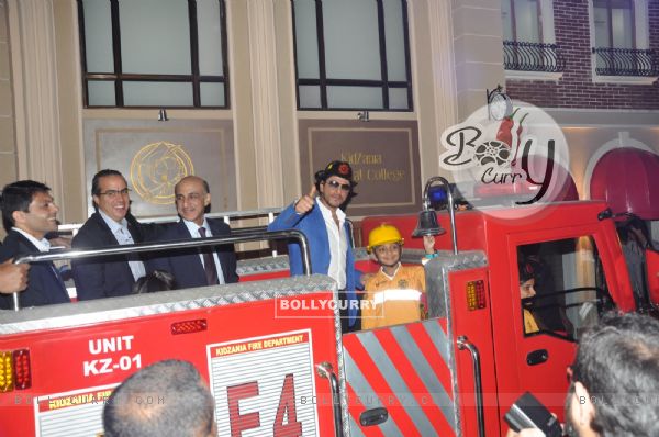 Shahrukh Khan signals the fire engine to move ahead at the Launch of Kidzania