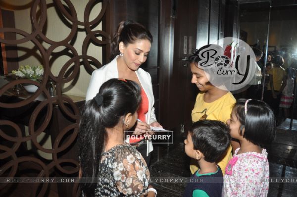 Madhuri Dixit signs an autograph for her fans during Dedh Ishqiya Promotions