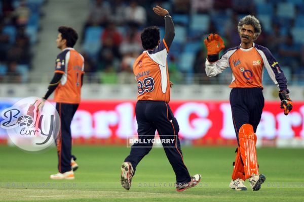 The Veer Marathi team celebrates a wicket taken