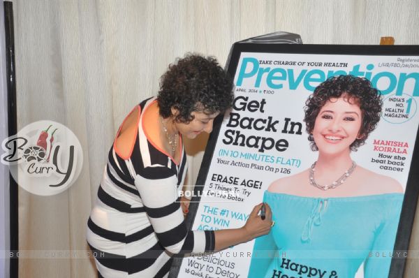 Manisha Koirala signs the cover of health magazine Prevention
