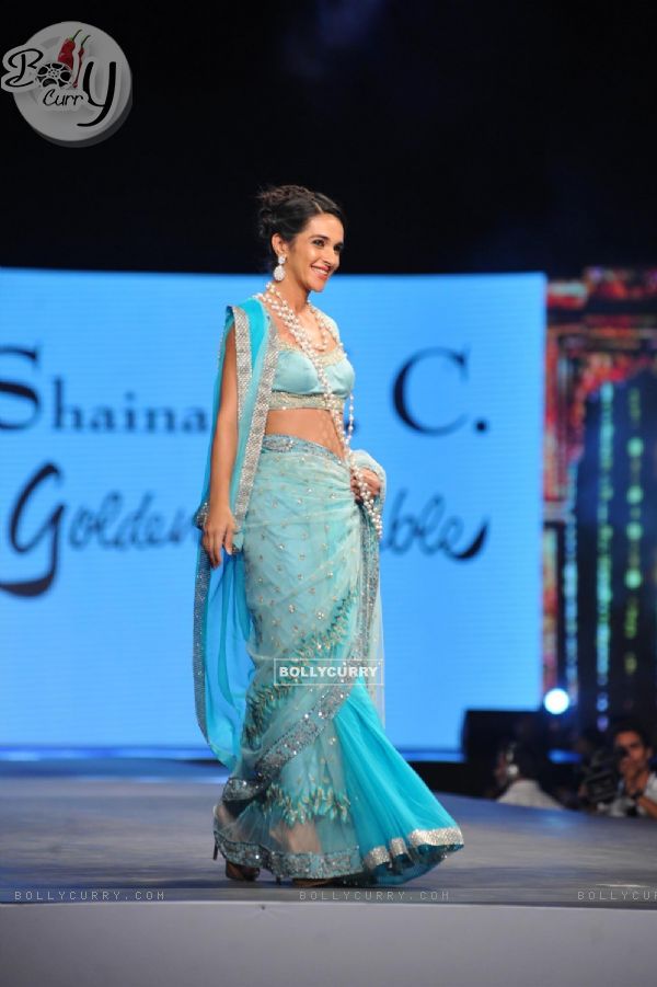 Tara Sharma walks the ramp at the 'Caring with Style' fashion show at NSCI