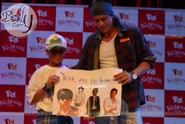 Shahrukh hourned  by a card made by a child at Kidzania