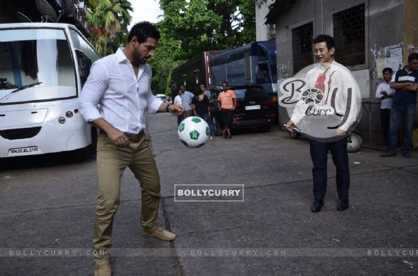 John Abraham playing football with Baichung Bhutia at Castrol Photo Shoot