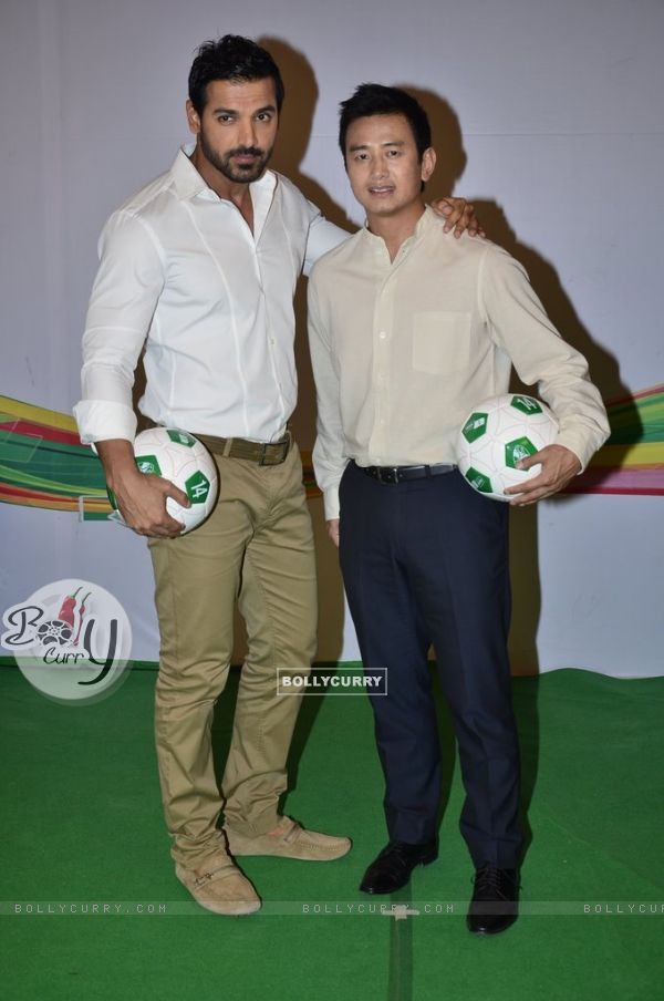 John Abraham clicks a pic with Baichung Bhutia at Castrol Photo Shoot