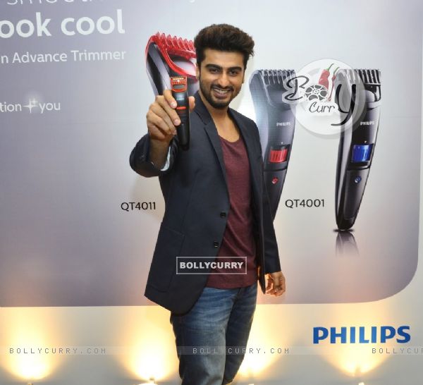 Arjun Kapoor poses with male grooming gadget