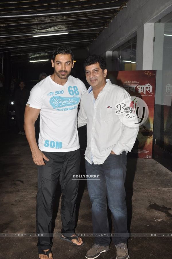 John Abraham with a guest at the Screening of Lai Bhari (326555)