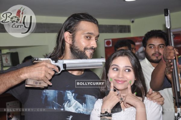 Akhil Kapur and Sasha Agha pose with a gun at the Promotions of Desi Kattey