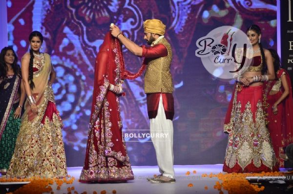 The bride and the groom garland each other at the IIJW 2014 - Day 2
