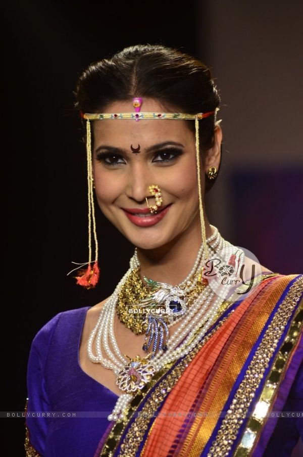 A model walks the ramp as a Maharashtrian bride at the IIJW 2014 - Day 2