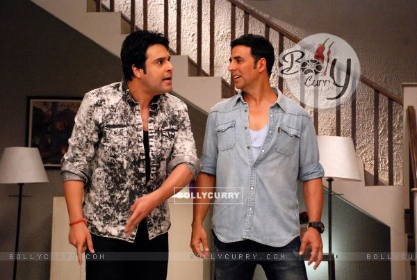 Akshay Kumar and Krushna Abhishek perform an act at the Promotion of It's Entertainment