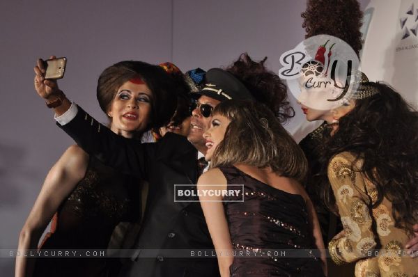 Narendra Kumar takes a selfie with his models at the Launch of his Swiss Calendar