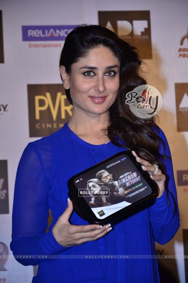 Kareena Kapoor holds a Singham Returns Merchandise at the Launch