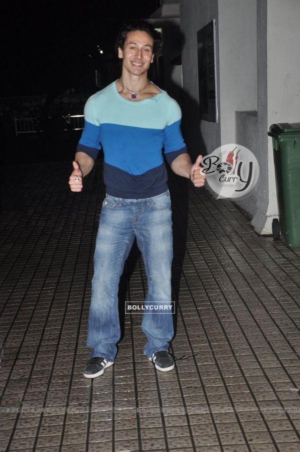 Tiger Shroff gives a thums up pose for the media at PVR