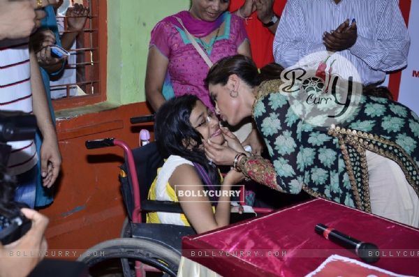 Rani Mukherjee was seen kissing a special child at the Promotion of Mardaani at a Local School