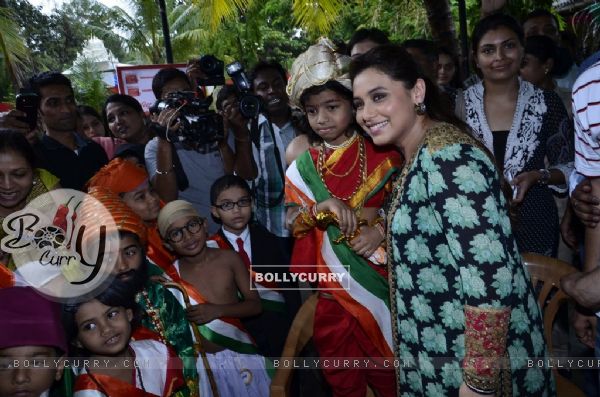 Rani Mukherjee poses with fancy dressed students at the Promotion of Mardaani at a Local School (330882)