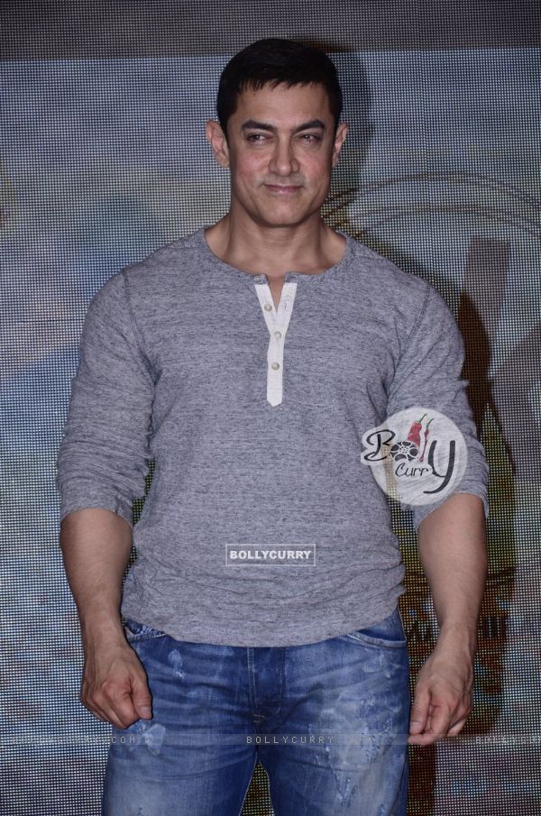 Aamir Khan poses for the media at the Second Poster Launch of P.K.