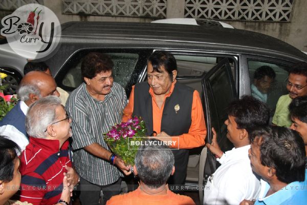 Ashok Pandit greets Manoj Kumar with a bouquet of flowers at the Bhoomipoojan of IFTDA's New Office