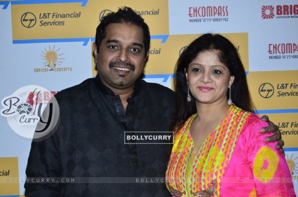 Shankar Mahadevan poses with wife at Shaan's Live Concert