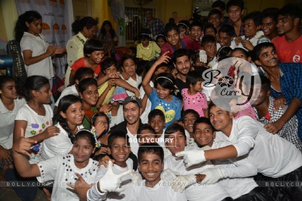 Varun Dhawan and Sidharth Malhotra pose with kids at Ashray Ngo