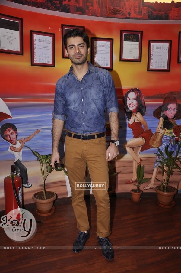 Fawad Khan poses for the media at the Promotions of Khoobsurat on 93.5 Red FM