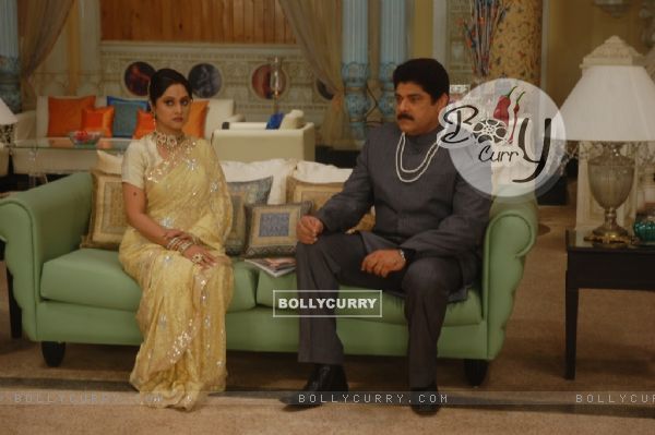 Raja Sahaab and Choti Rani sitting on a sofa