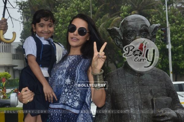 Neha Dhupia clicks a picture with a young fan