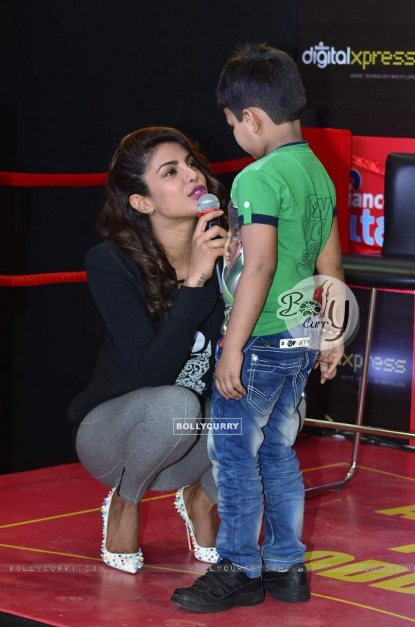Priyanka Chopra speaks to a young fan at the Promotions of Mary Kom at Reliance Outlet