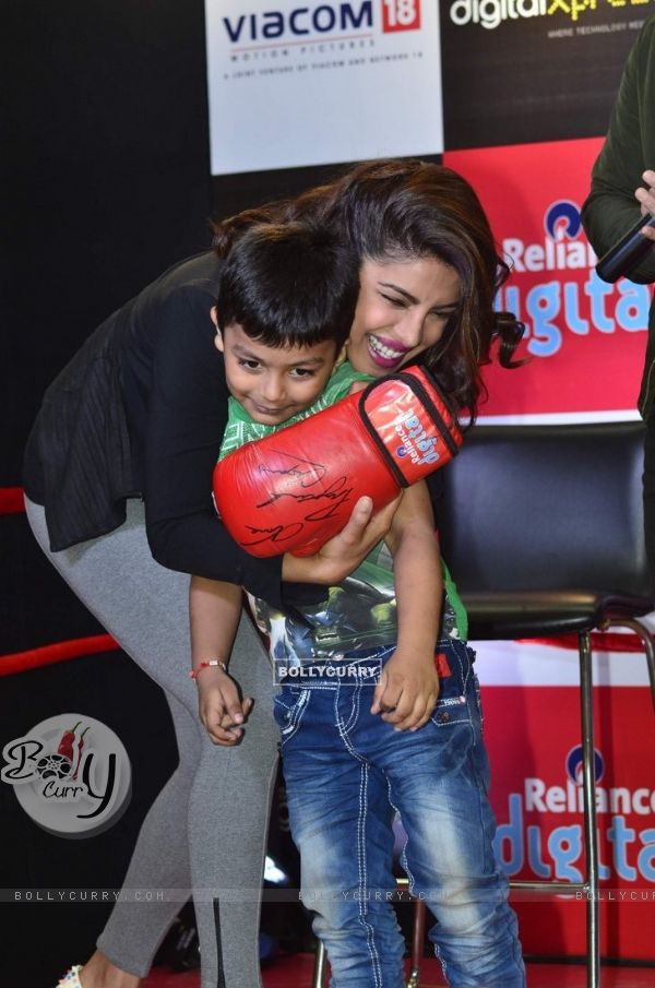 Priyanka Chopra hugs a young fan at the Promotions of Mary Kom