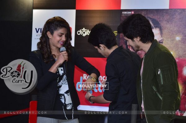 Priyanka Chopra recieves a hand made bracelet by a fan at the Promotions of Mary Kom at Reliance Out