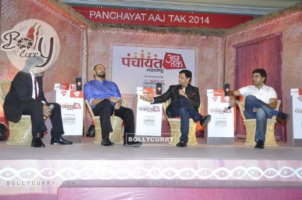 Madhur Bhandarkar interacting with the host at Aaj Tak Panchayat Talk Show
