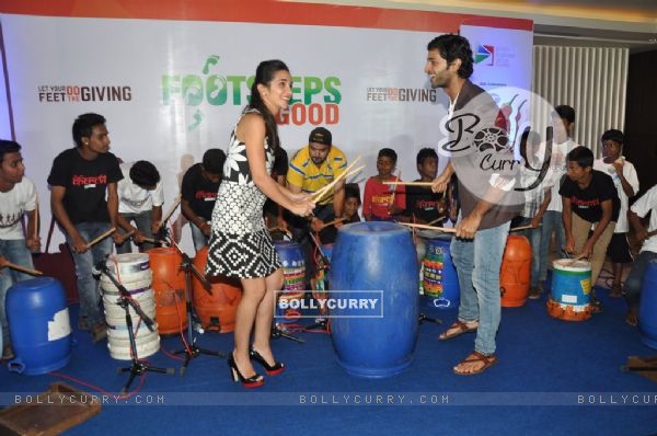 Purab Kohli and Tara Sharma playing the drum at Footsteps 4 Good Ngo Event