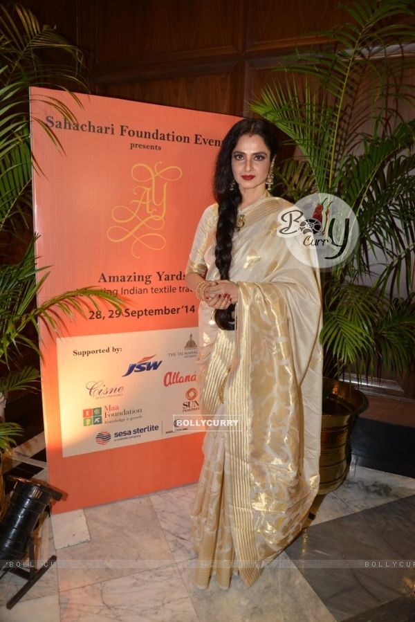 Rekha poses for the media at Sahachari Foundations Show for Tarun Tahiliani