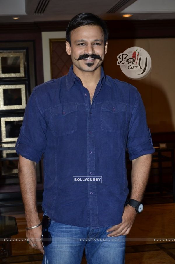 Vivek Oberoi poses for the media at the Book Launch of Haider, Omkara and Maqbool