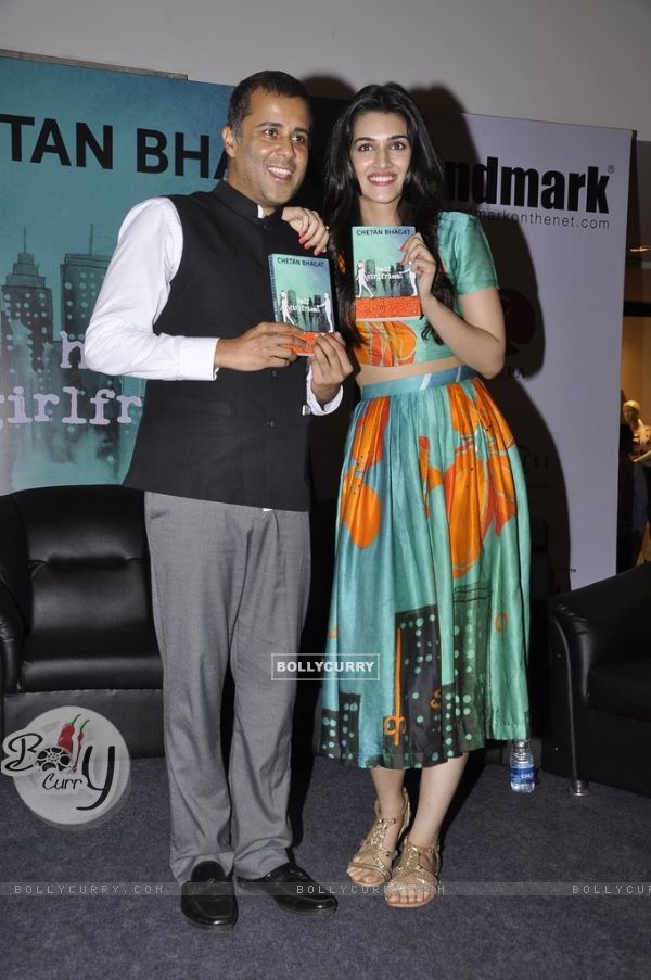 Kriti Sanon poses with Chetan Bhagat at the Book Launch of Half Girlfriend