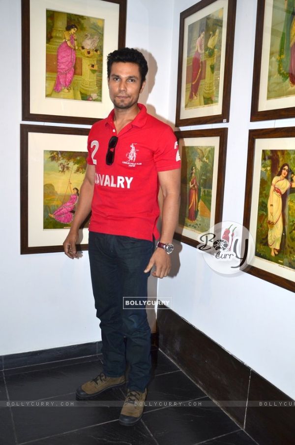 Randeep Hooda poses for the media at the Promotion of Rang Rasiya with an Art Exhibition