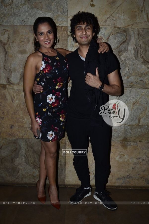Sonu Niigam poses with Richa Chaddha at the Special Screening of Tamanchey
