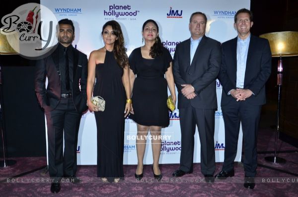 Celebs pose for the media at the Launch of Planet Hollywood