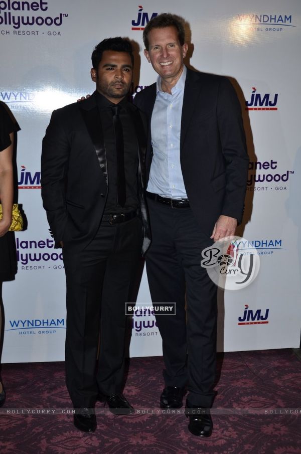 Sachin Joshi poses with a delegate at the Launch of Planet Hollywood