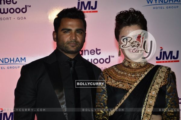 Sachin Joshi poses with wife Urvashi Sharma at the Launch of Planet Hollywood