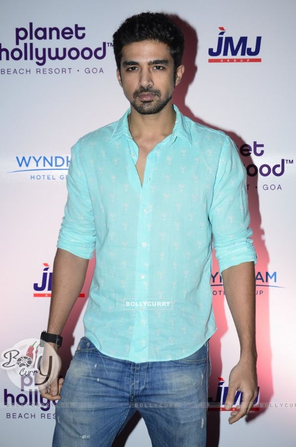 Saqib Saleem poses for the media at the Launch of Planet Hollywood